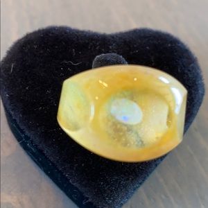 Yellow glass ring with opal inside. Brand new!